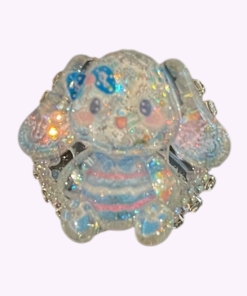 Glinsterende siliconen kraal van een blauw-roze olifantenfiguurtje met, strik en glitterdetails – perfect voor kawaii sleutelhangers of DIY pennen